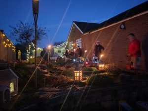 The SLR lit up by lanterns, solar lights and flame torches